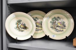 A Clarice Cliff Cotswold Newport pattern oval dish having country scene and gilt edging, w28cm, sold