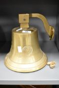 A brass ship bell having wall bracket and impressed mark for '1841', h24cm