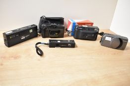 Five compact cameras, to include a voightlander vitored 110 pocket camera, a canon sure shot z70w, a