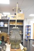 An interesting Chinese cast-bronze vessel of archaic design, having patinated finish, later convert
