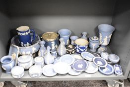 A group of Wedgwood Jasper ware decorated with classical motifs on a blue ground, to include
