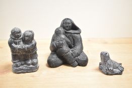 An original wolf sculpture of inuit and child, h13, sold together with inuit couple and baby