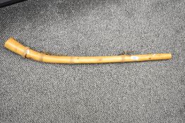 A tribal wooden horn, L79cm
