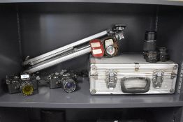 Two Chinon CE-4 camera bodies with RMC Tokina 1:4 25-50mm lens, a SMC Pentax M Zoom 1:4 75-150mm