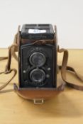 A Rolleiflex 'Old Standard' TLR camera, with a Zeiss Tessar f3.8 75mm lens. With brown leather