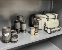 A selection of lenses, slide duplicator, and extention tubes. A Dallmeyer Ser XIV marked 1:4