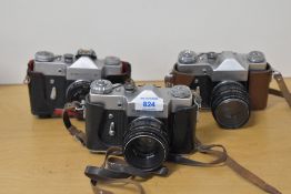 Three Zenit B 35mm cameras, one with a Industar 50mm f3.5 lens, two with Helios 58mm f2 44-2 lens.