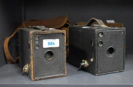 Two Kodak Brownie box cameras. One No. 2 Brownie Model D, one No. 2 Brownie Model F, with hinged