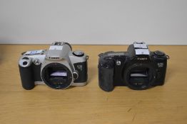 Two Canon 35mm cameras, a Canon EOS 500 and Canon EOS 500N. The Canon EOS 500 was the world’s