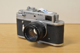 A Zorki 4K 35mm rangefinder camera with Jupiter-8 50mm f/2 Lens, with black leather case and strap.
