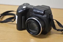 A Samsung SCD5000 digital camcorder with accessories and bag. Sold alongside an Olympus SP-500UZ