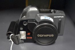 An Olympus AZ-300 Superzoom camera with Olympus 1:4,5-5,6 38-105 lens