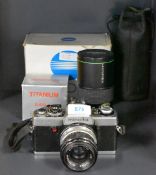 A Minolta XG1 camera with Hanimex Wide 1:3,5 35mm lens, a Hanimex Automatic Zoom 1:4,5 80-200mm
