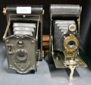 Two folding bellows cameras, a Kodak No. 2 Folding Autographic Brownie and a Rajar No. 6 camera.