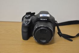 A Sony DSC-H400 digital 'bridge' camera, with 63x opitical zoom lens, f3.4-6.5. With Sony battery