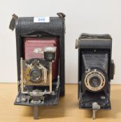 Two Kodak folding cameras. A Brownie Six-20 and a Kodak No3 folding Pocket camera.