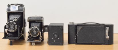 Three folding cameras and a box camera. A Voigtlander Bessa, a F. Deckel Dolly and a Kodak No2 A (