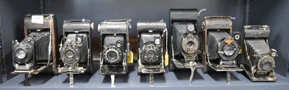 Seven folding cameras including an Ensign Flush Back Popular 21/4B, a Kodak No1 Pocket, an Ensign