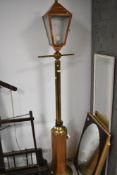 A vintage copper and brass standard lamp, modelled as street lamp, height approx. 172cm