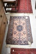 A vintage Persian/Sarouk style rug, approx 106 x 65cm