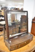 A 19th Century mahogany toilet mirror , having bow fronted drawer base, width approx. 57cm