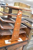 An Oriental style occasional table/magazine rack