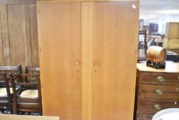 A vintage golden oak wardrobe