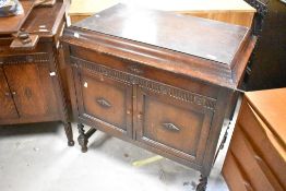 An early 20th Century Gilbert Gramophone in double width oak cabinet