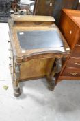 A Victorian walnut Davenport desk