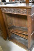 A traditional carved oak bookcase, width approx. 91cm