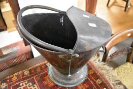 A traditional copper coal helmet , probably 19th Century , height approx. 40cm, some surface rust to