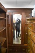 A Victorian mahogany mirror door wardrobe
