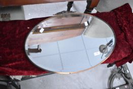A vintage copper framed wall mirror, width approx. 61cm