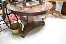 A William IV mahogany dining/breakfast table having circular top on typical triform platform base