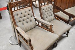 Two Victorian salon easy chairs , having bobbin turned decoration and button back upholstery