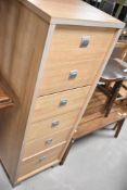 A modern laminate narrow chest of drawers