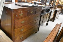 A 19th Century oak chest of three small over three long drawers, with brass handles and bun feet,