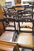 A set of four 19th Century mahogany railback dining chairs