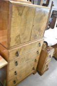 A mid 20th Century walnut tallboy and dressing table
