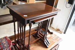 A reproduction Regency mahogany nest of three tables