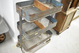 A vintage metal tool or parts trolley
