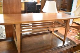 A vintage teak coffee table having slatted undertier, approx. 110 x 40cm