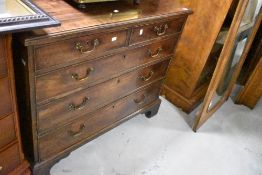 A 19th Century mahogany chest of two over three drawers, having brass drop handles, on bracket feet,