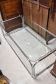 A vintage chrome and glass coffee table, approx. 129 x 62cm