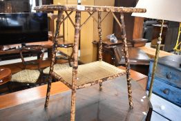 A bamboo occasional table with undertier