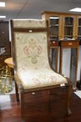 An Edwardian mahogany nursing chair