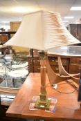 A modern brass and wood table lamp of large proportions