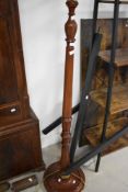 A reproduction mahogany effect standard lamp