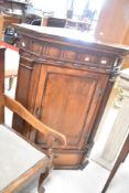 A Georgian mahogany corner cupboard, height approx. 124cm