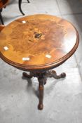 A reproduction occasional table in the Continental style